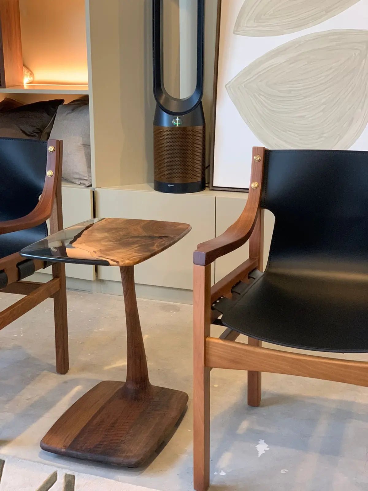 Artisan luxury resin table sculpting unifies natural live-edge walnut wood with clear resin tone contrast at Home Man Cave