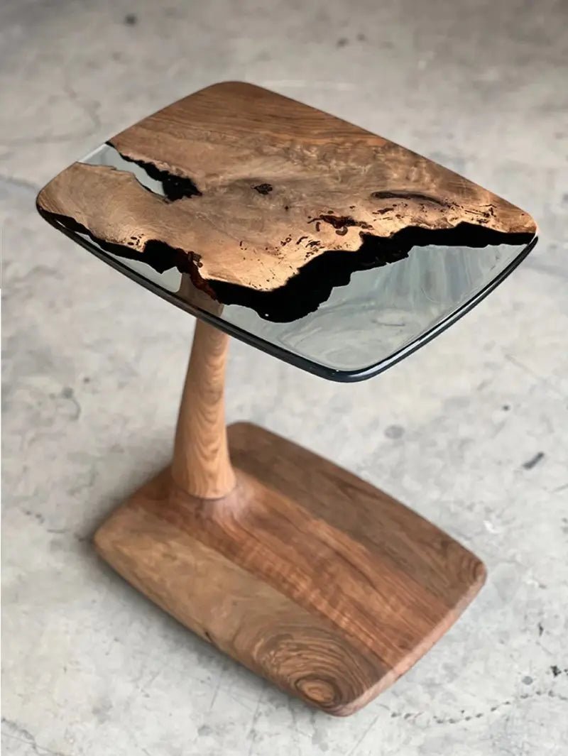Aurelia luxury resin table craftsmanship highlights aged solid walnut timber and optical clear resin epoxy finishing work