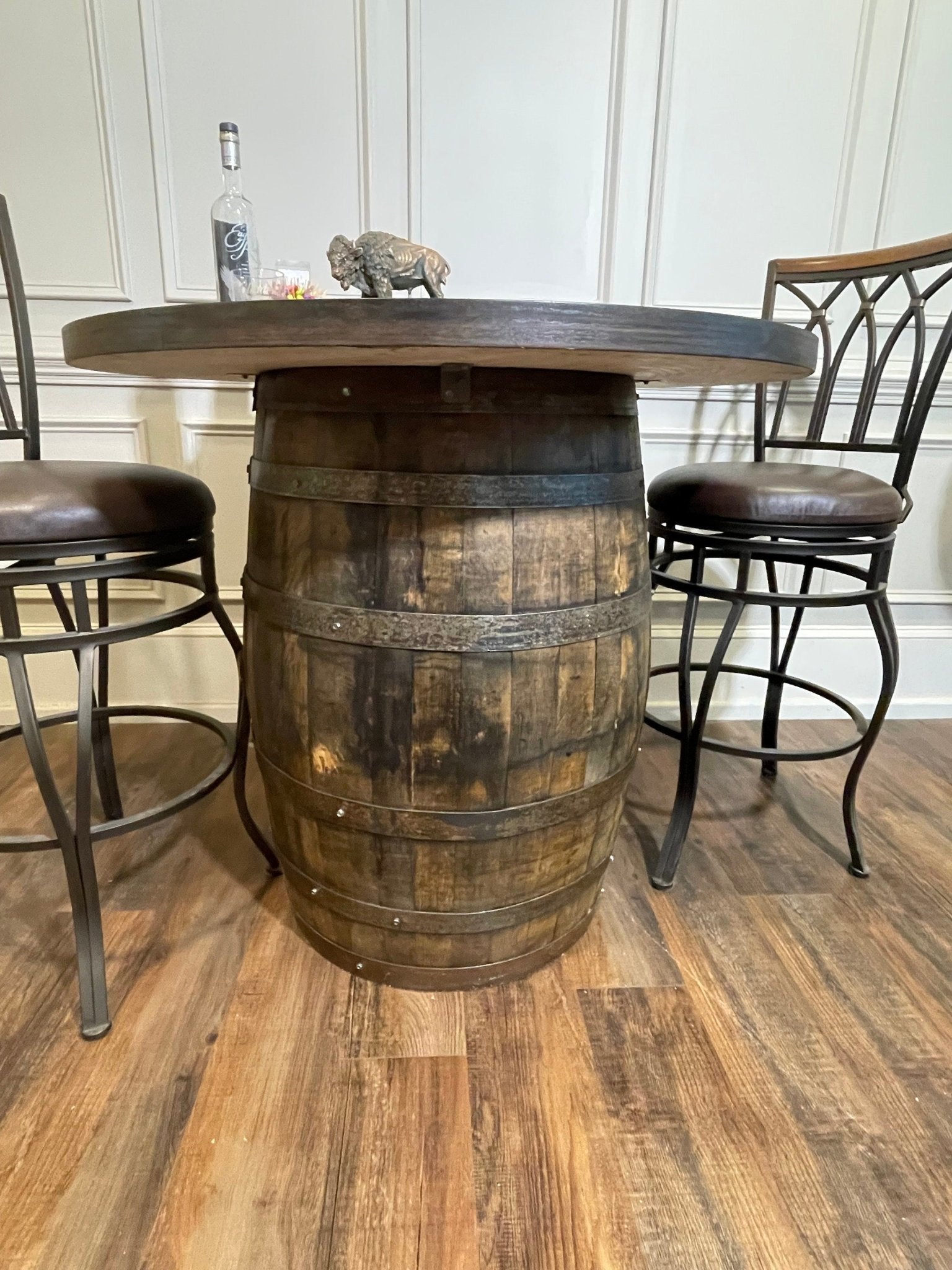 Artisan bourbon barrel table crafted from aged oak staves to anchor sophisticated estate game lounge bars at Home Man Cave.