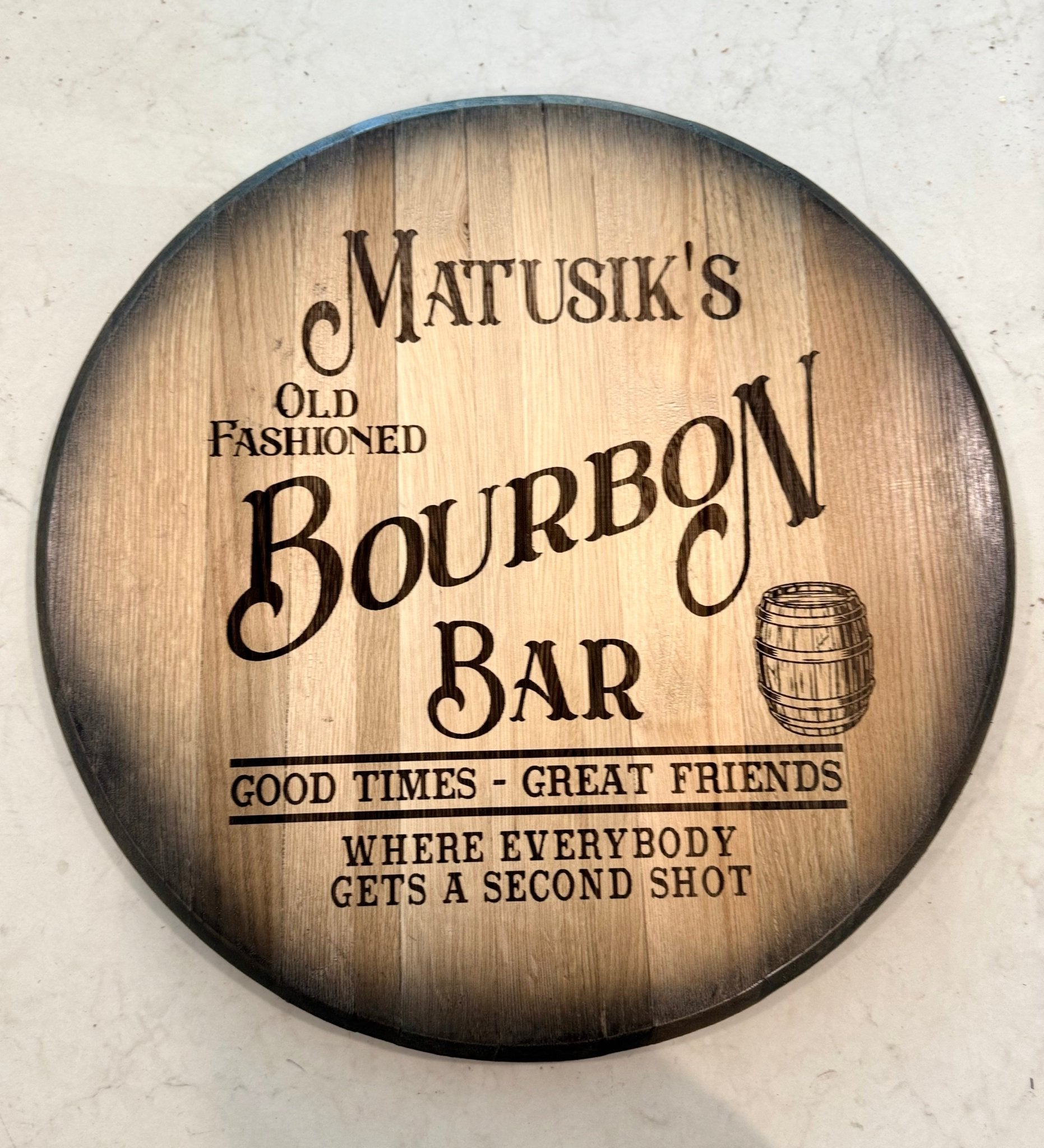 Authentic bourbon barrel bar sign masterfully hand-crafted from reclaimed white oak cask tops for executive bar wall decor.