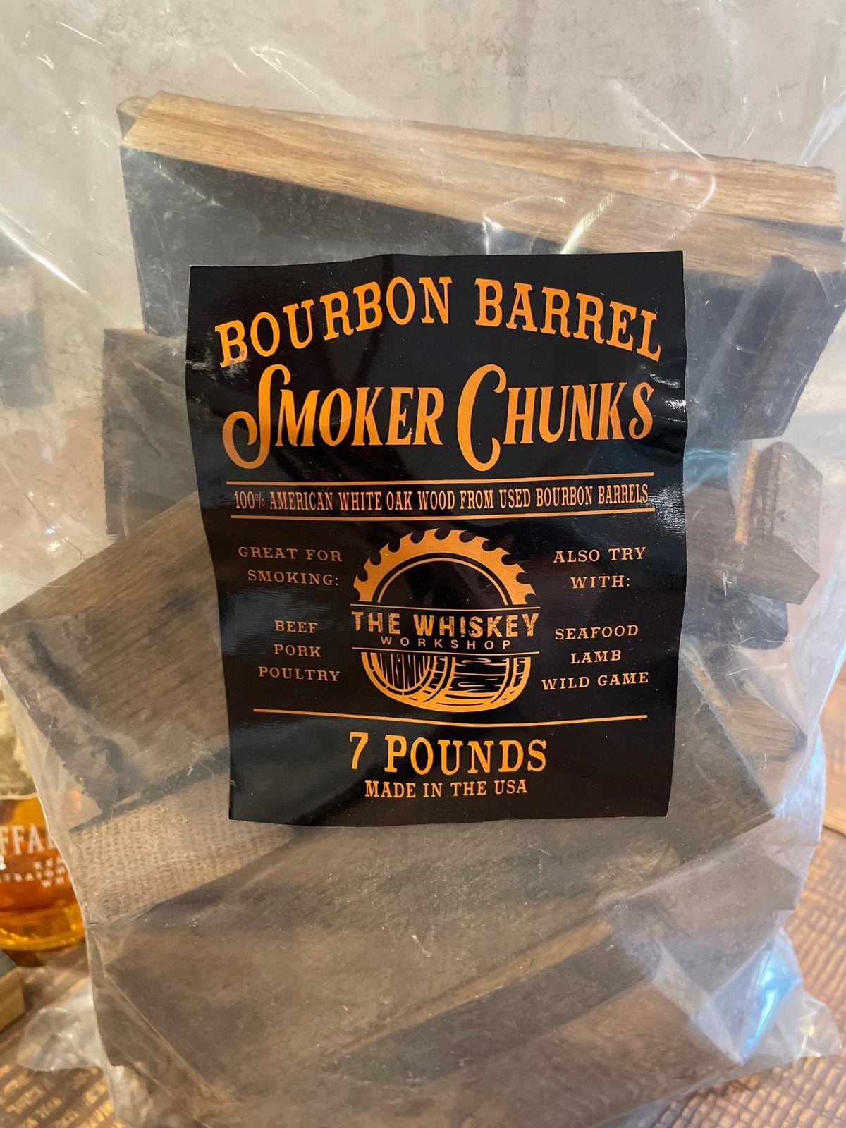 Artisan bourbon barrel smoking wood packaged in a sealed seven-pound parcel of authentic charred American white oak staves.