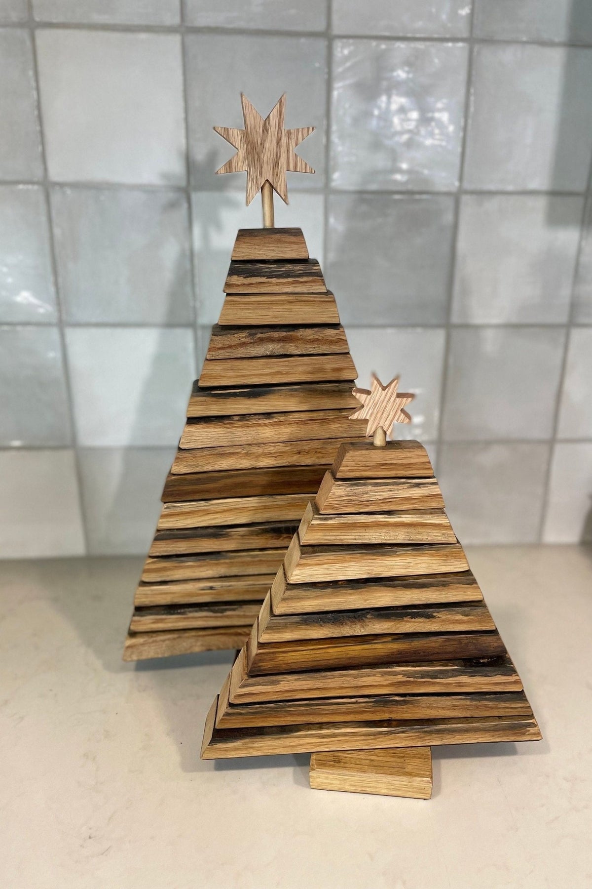 Artisan barrel christmas tree set crafted in two graduated tiers using authentic charred bourbon barrel wood components.