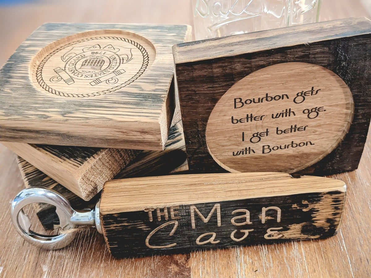 Custom whiskey barrel cutoffs crafted into engraved coasters and bottle openers for bespoke bar lounges at Home Man Cave.