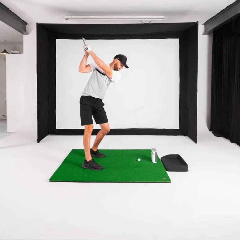 GolfBays EasySim golf simulator enclosure integrated with launch tracking in an architectural golf suite at Home Man Cave
