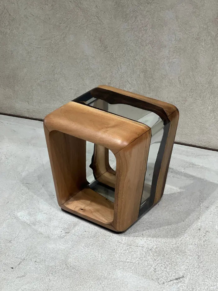 Minimalist resin side table showcasing hand-finished organic live-edge timber encased in seamless optical-grade epoxy resin.