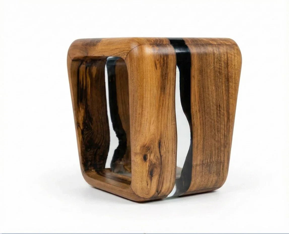 Handcrafted resin side table fusing natural solid timber with crystal-clear epoxy resin for artisanal structural strength.