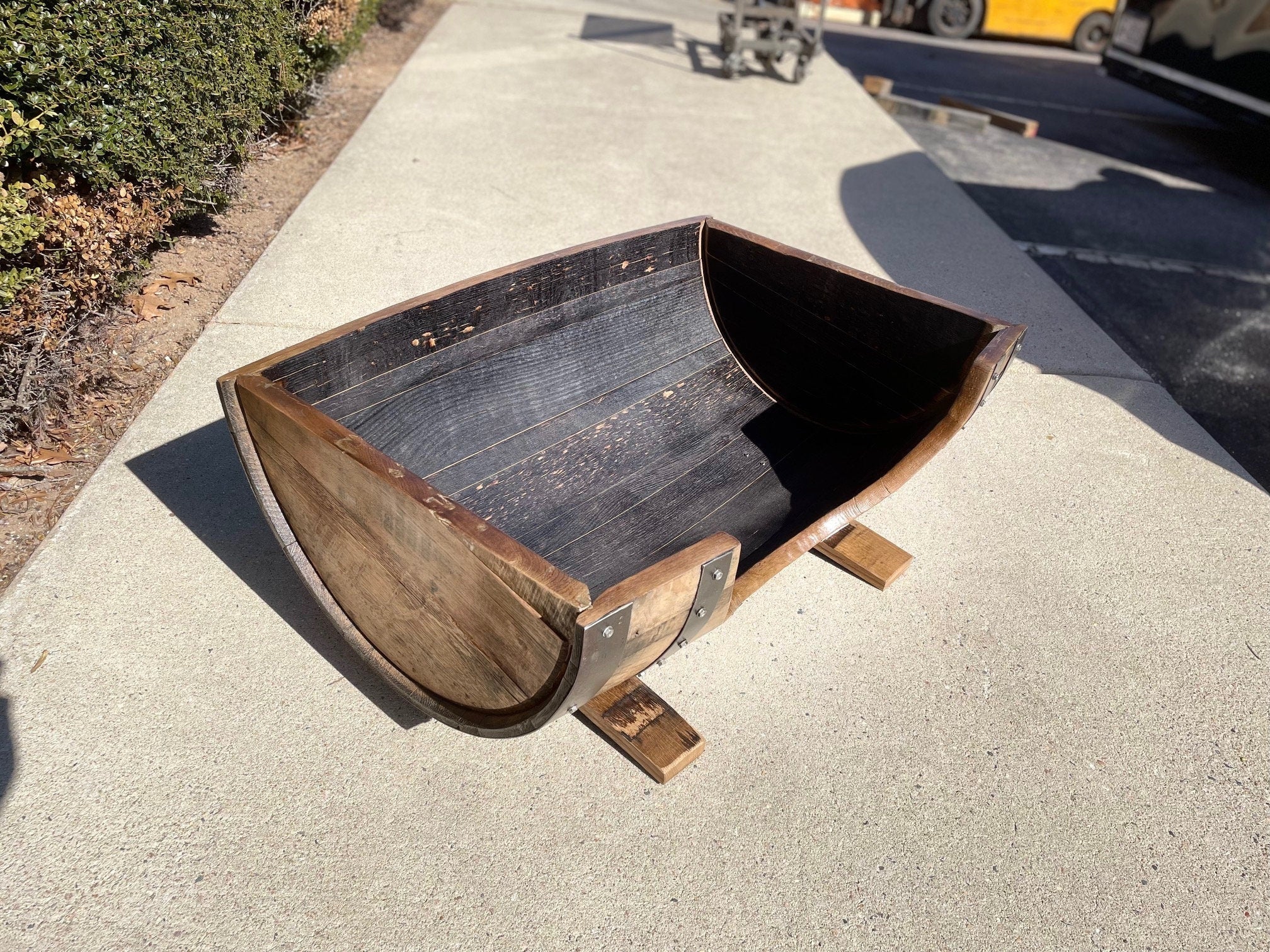 Architectural reclaimed dog bed featuring a hand-sanded sealed interior basin and heavy-duty solid oak support base legs.