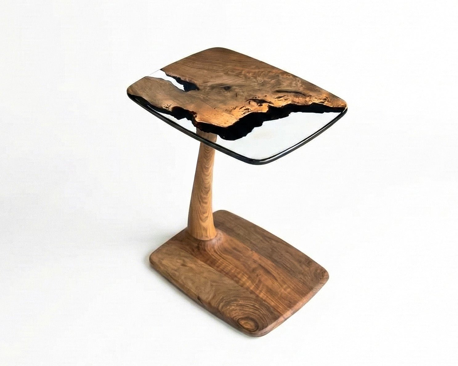 Aurelia luxury resin table construction features metal-free organic walnut wood joinery with crystal epoxy encasement coats