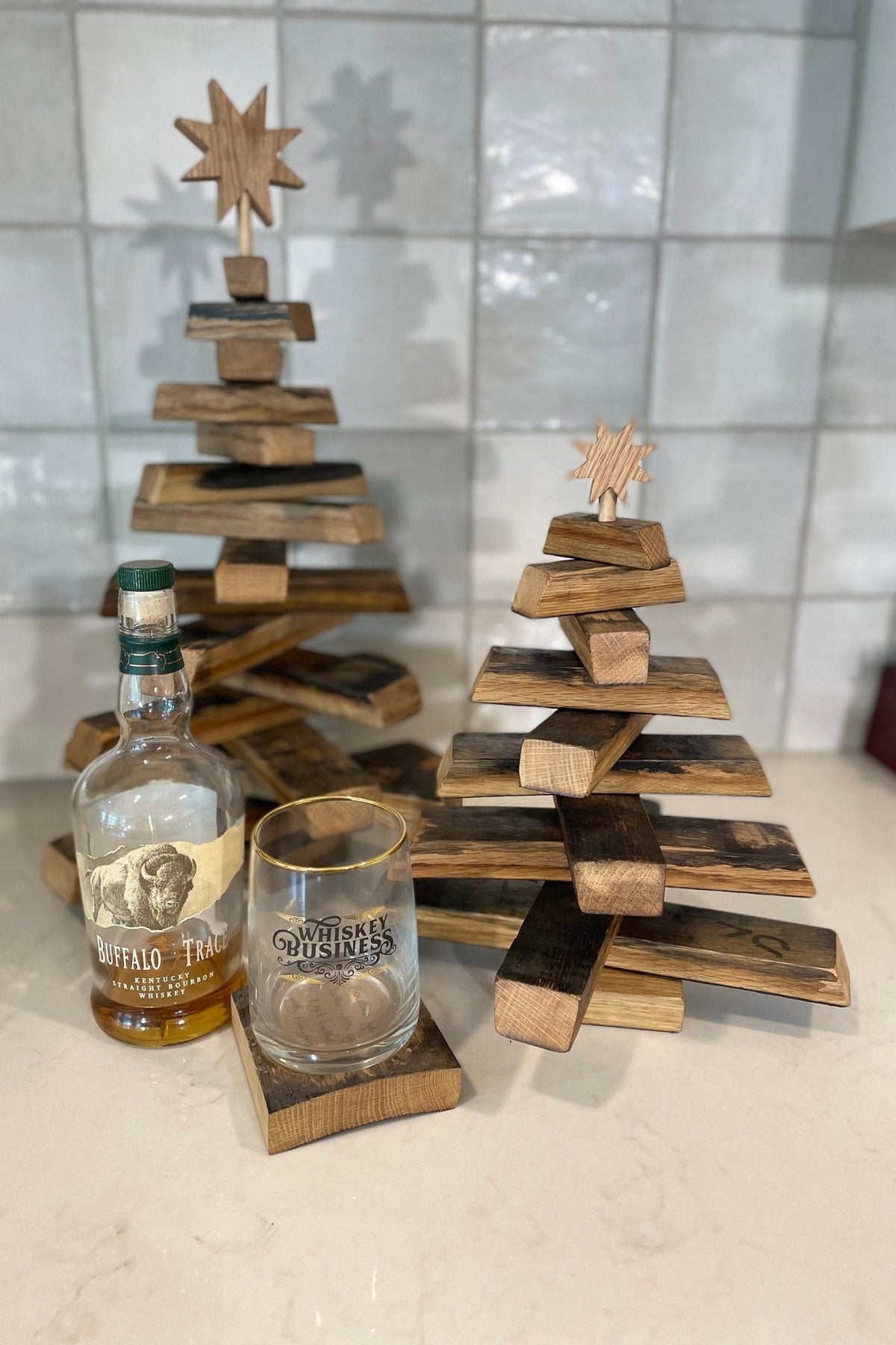 Bespoke barrel christmas tree display styled with vintage whiskey bottles in executive tasting lounges at Home Man Cave.