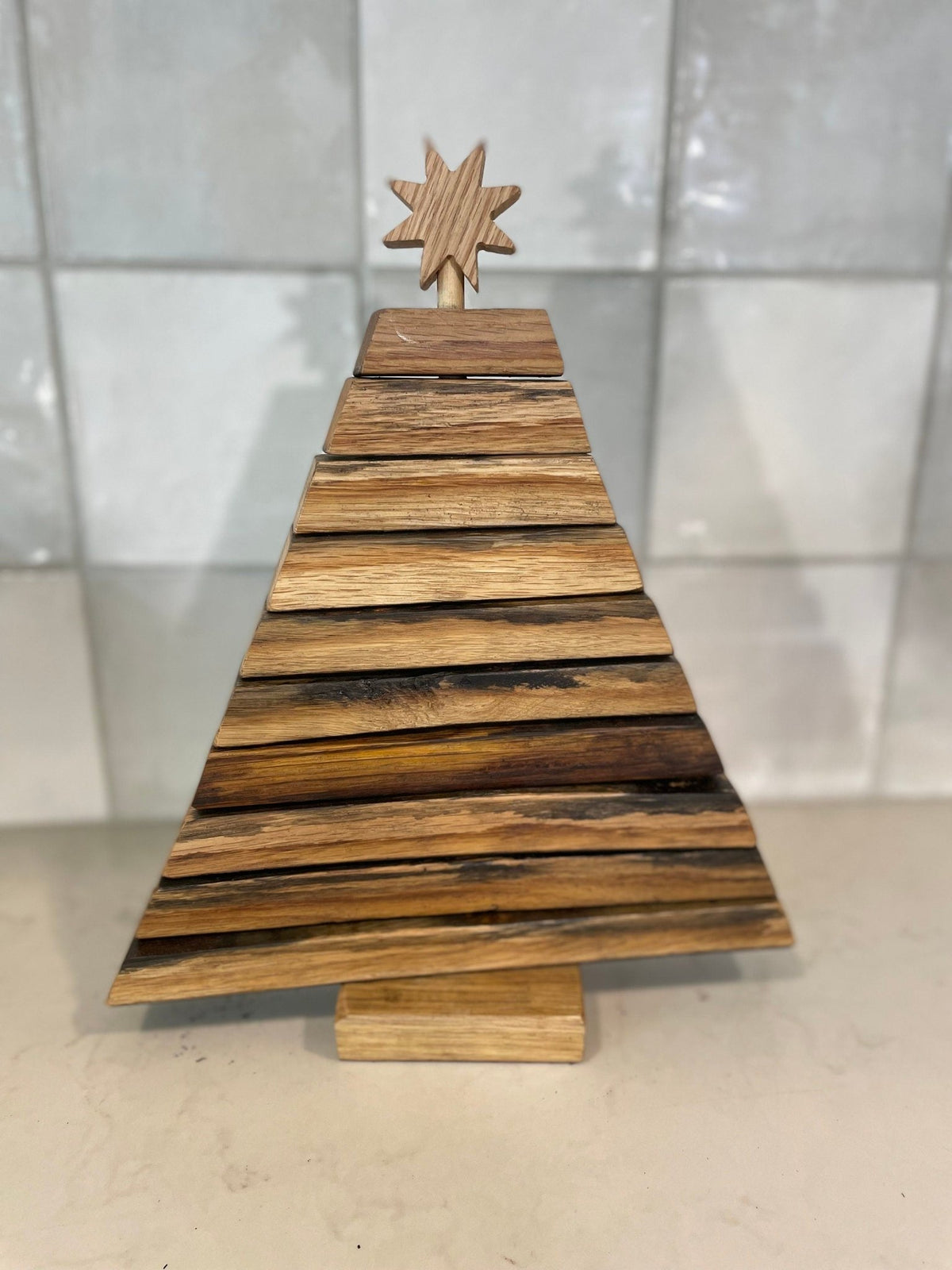 Custom barrel christmas tree featuring hand-sanded American white oak branches finished with authentic cooperage char marks.