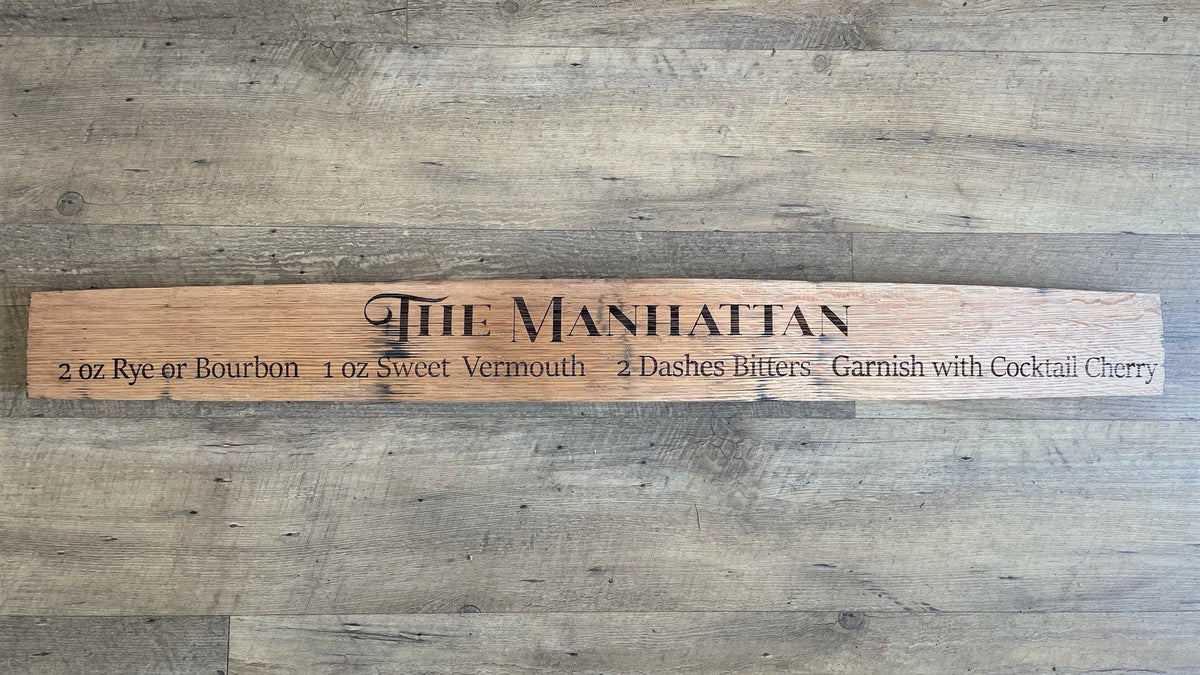 Bespoke cocktail recipe stave sign showcasing precision laser-etched Manhattan mixology ratios on curved solid white oak.
