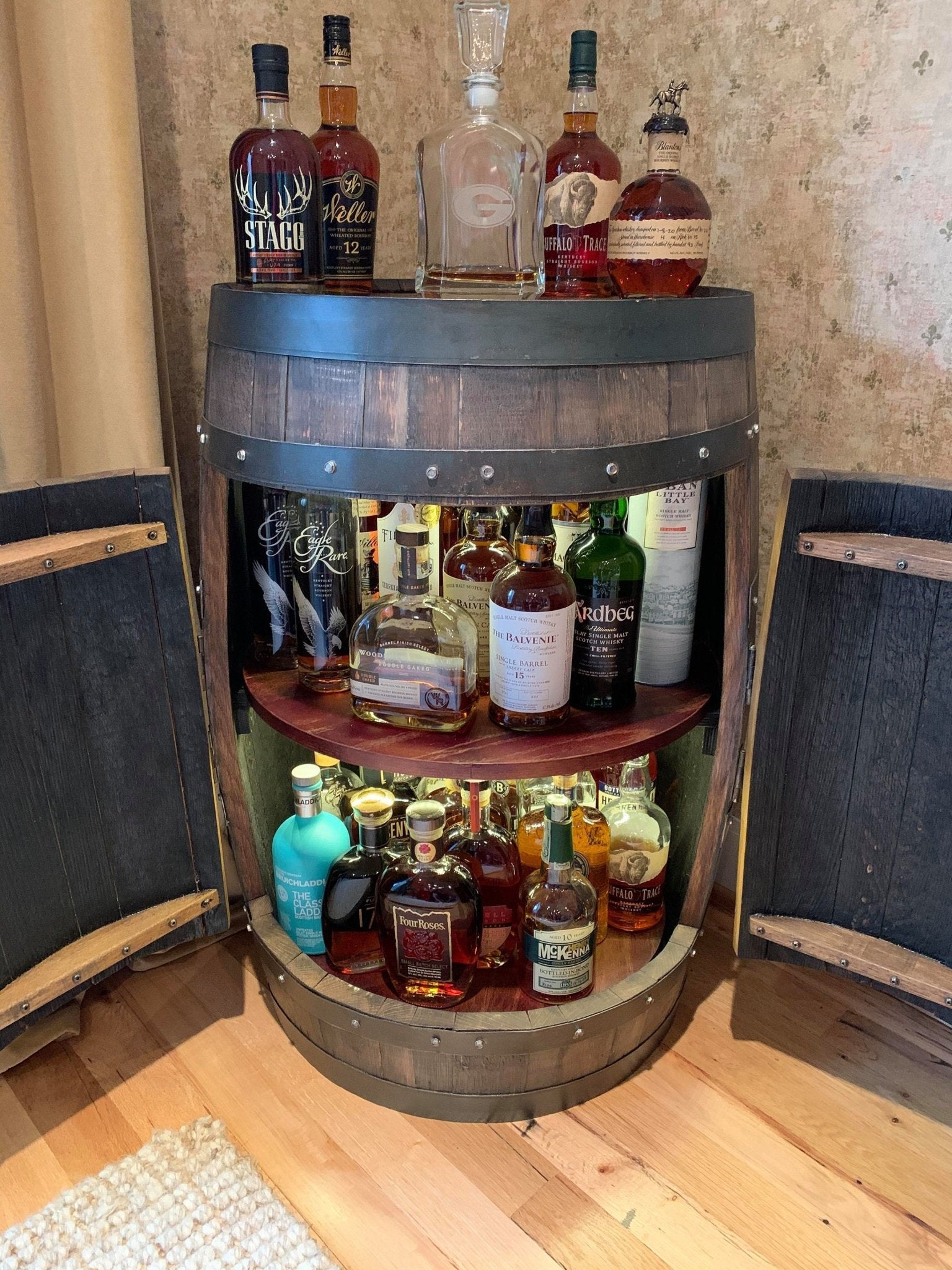 Bespoke bourbon barrel cabinet built with dual rotating solid oak lazy susan shelves for estate home bars at Home Man Cave.