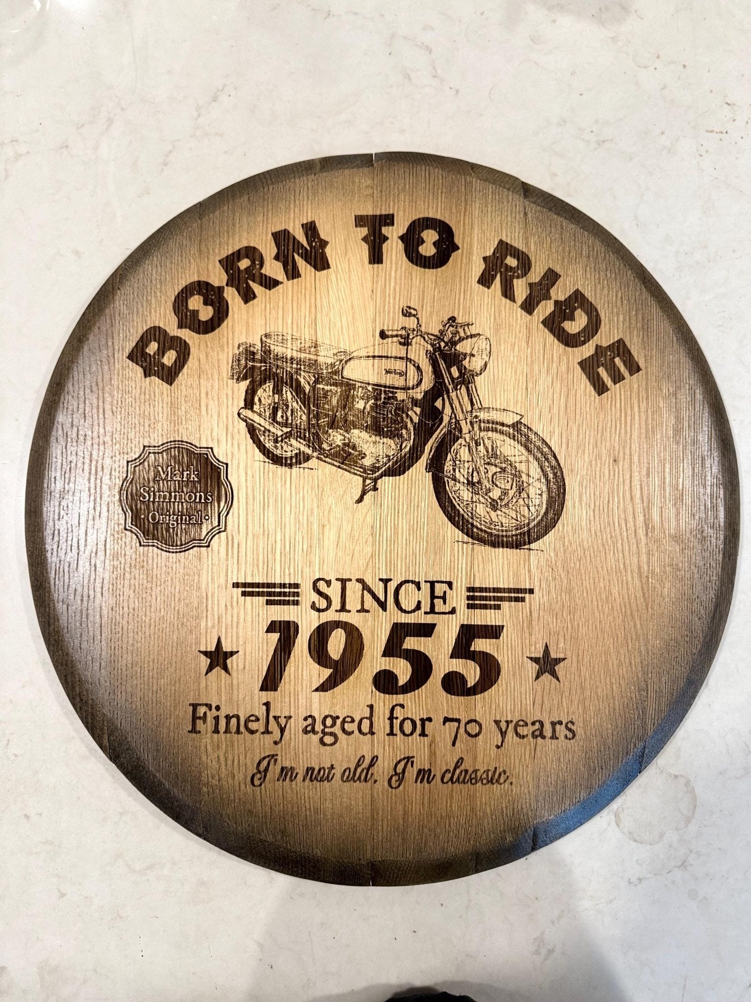 Bespoke bourbon barrel table with custom motorcycle commemorative laser engraving on reclaimed spirit aged oak timber head