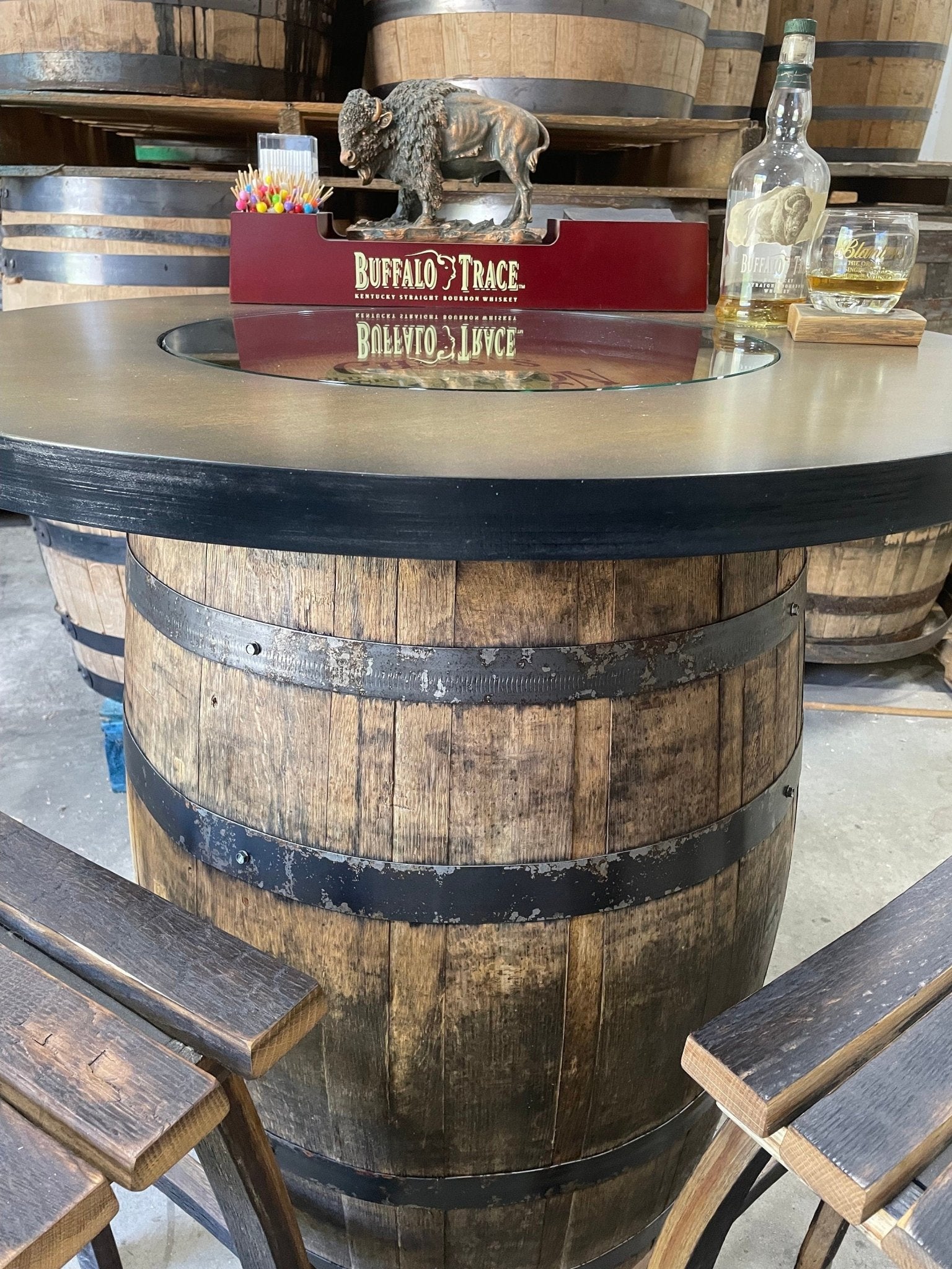 Handcrafted bourbon barrel pub table built with 38 inch pub height solid oak staves and rotating interior lazy susan shelving