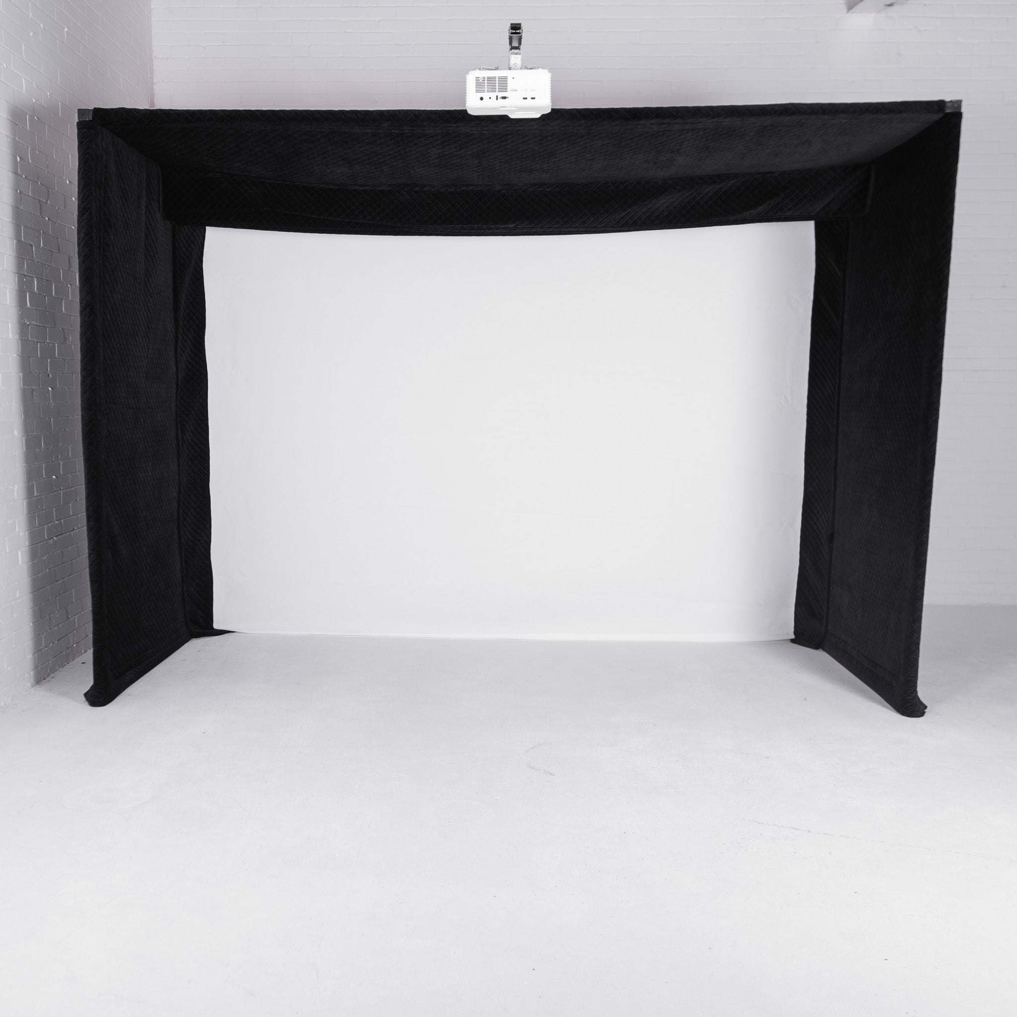 GolfBays Lux golf simulator enclosure – open side view showing interior hitting bay