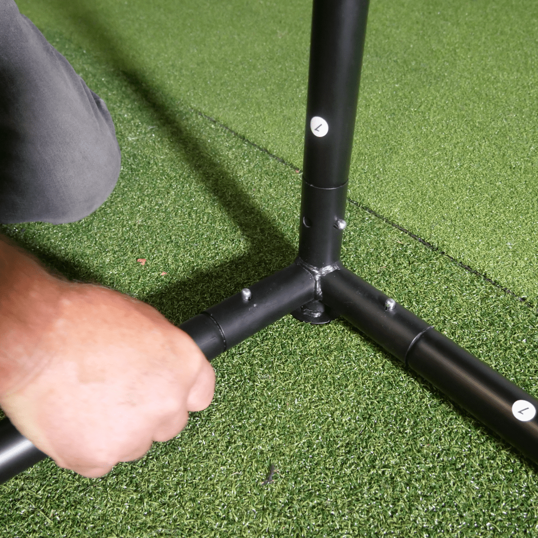 SimBox golf simulator enclosure frame assembly – easy corner joint connection on green turf